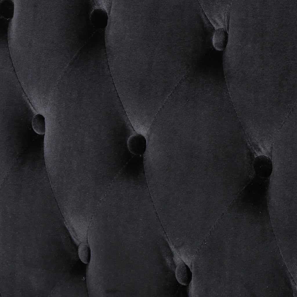 Canapé à oreilles hautes capitonné en velours noir