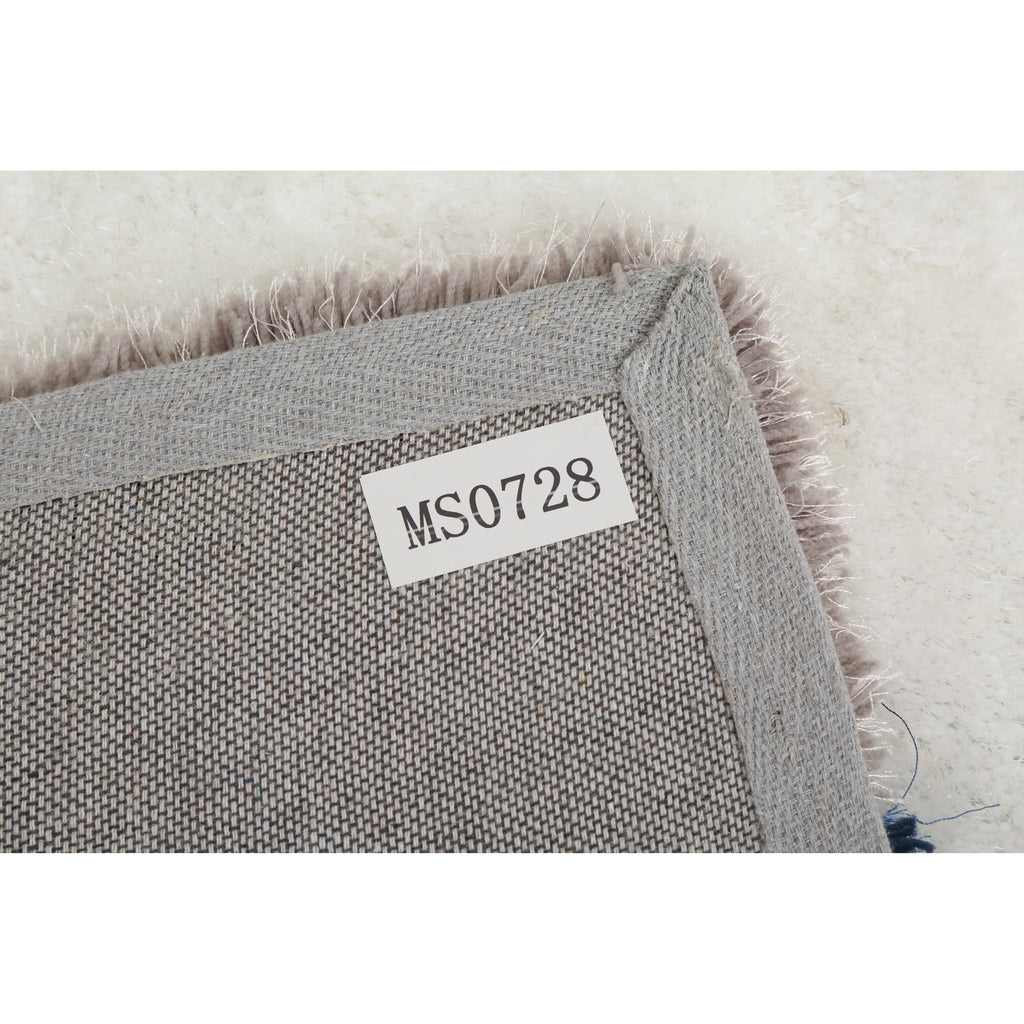 Tapis à poils longs Mateos au design abstrait